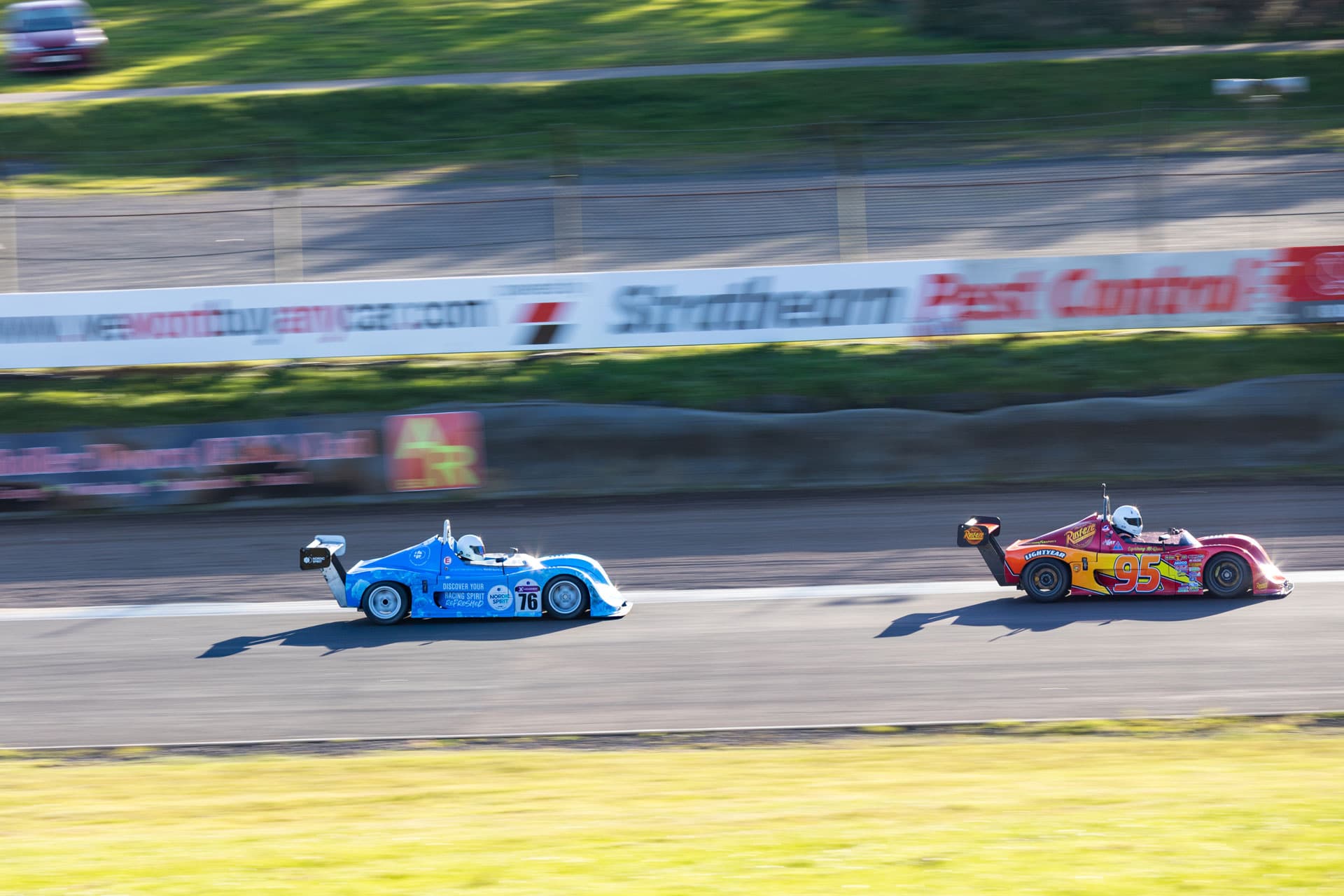 Leading car cutting through a slow blur